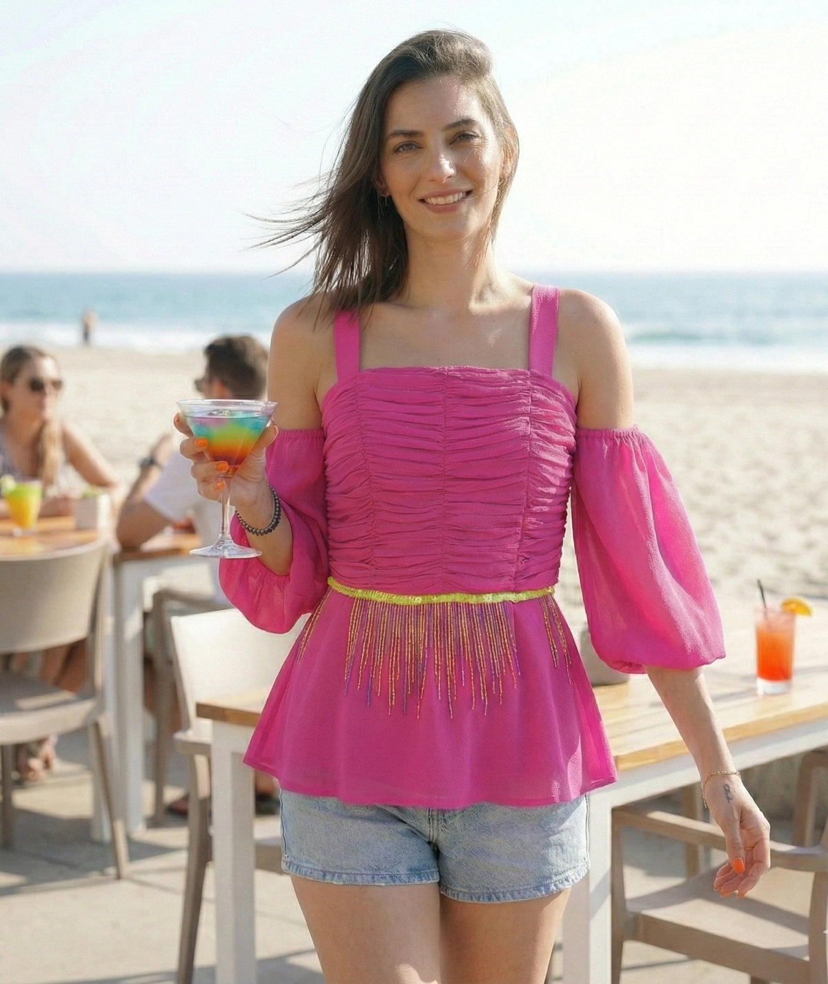 Top peplo rosa shocking con ricamo di paillettes