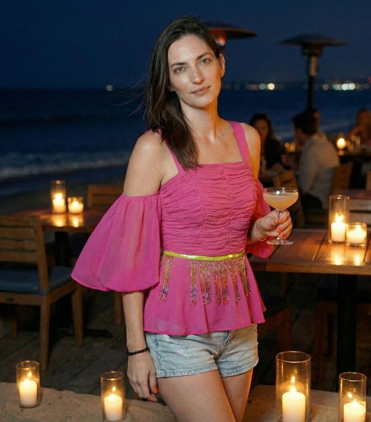 Top peplo rosa shocking con ricamo di paillettes