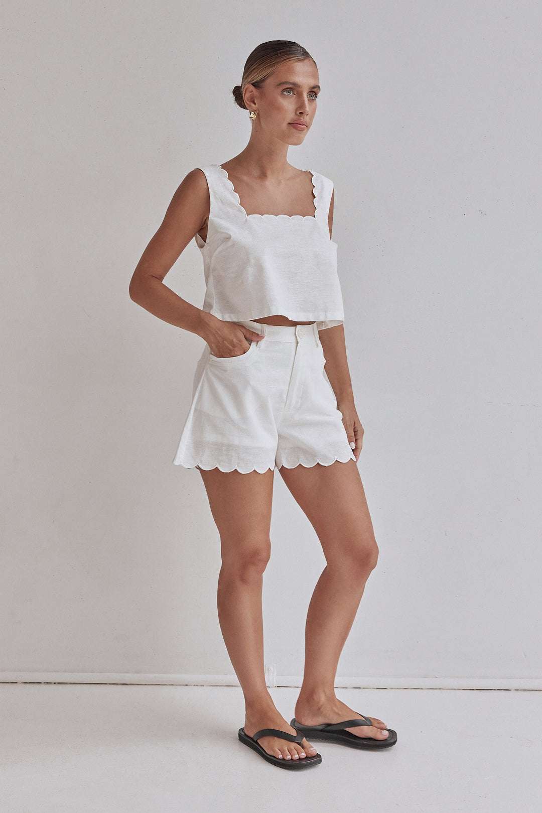 White linen shorts for women with scalloped hem and high waist