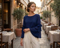 Top in georgette blu navy con maniche svasate e dettagli a fiocco
