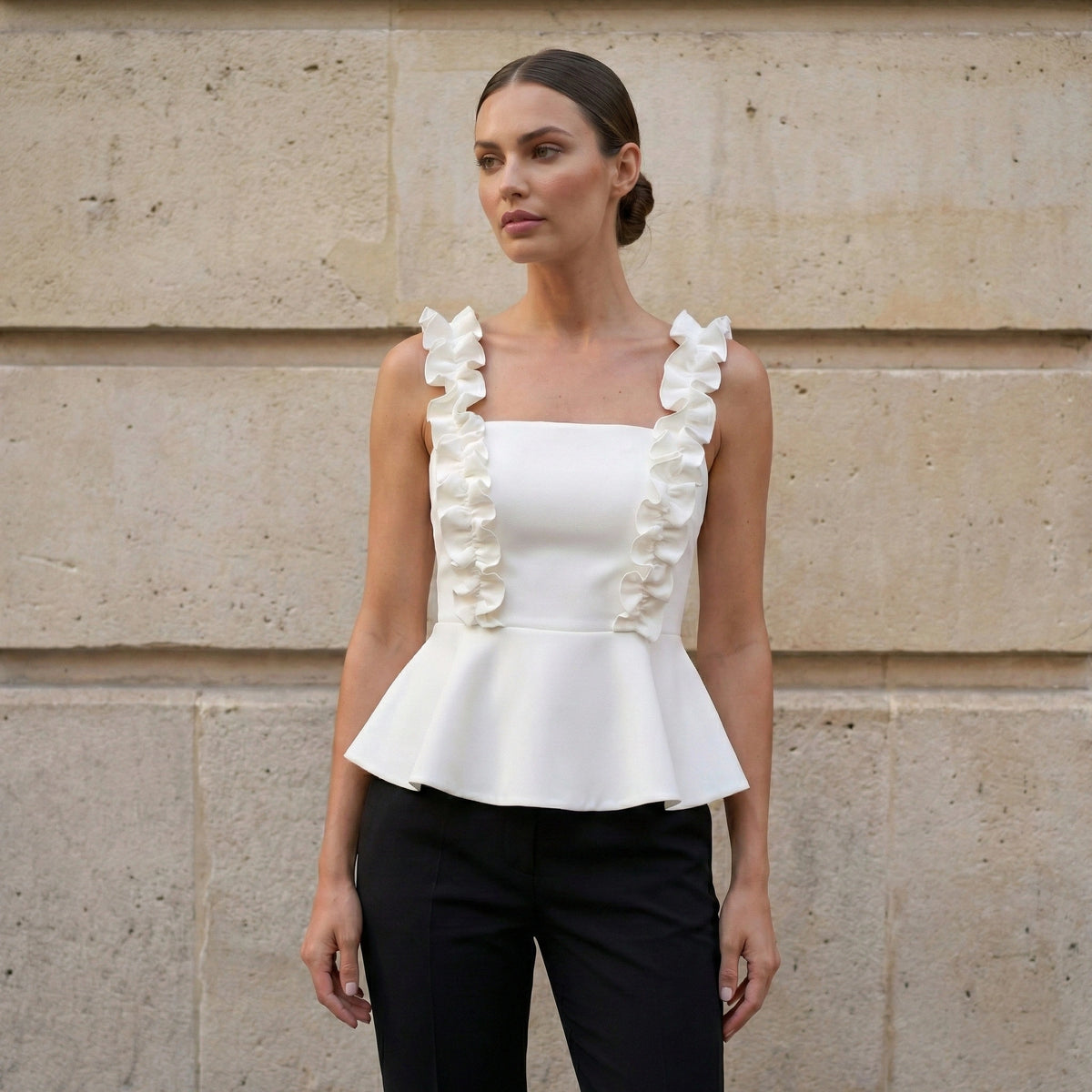 Top peplo bianco con spalline a balze