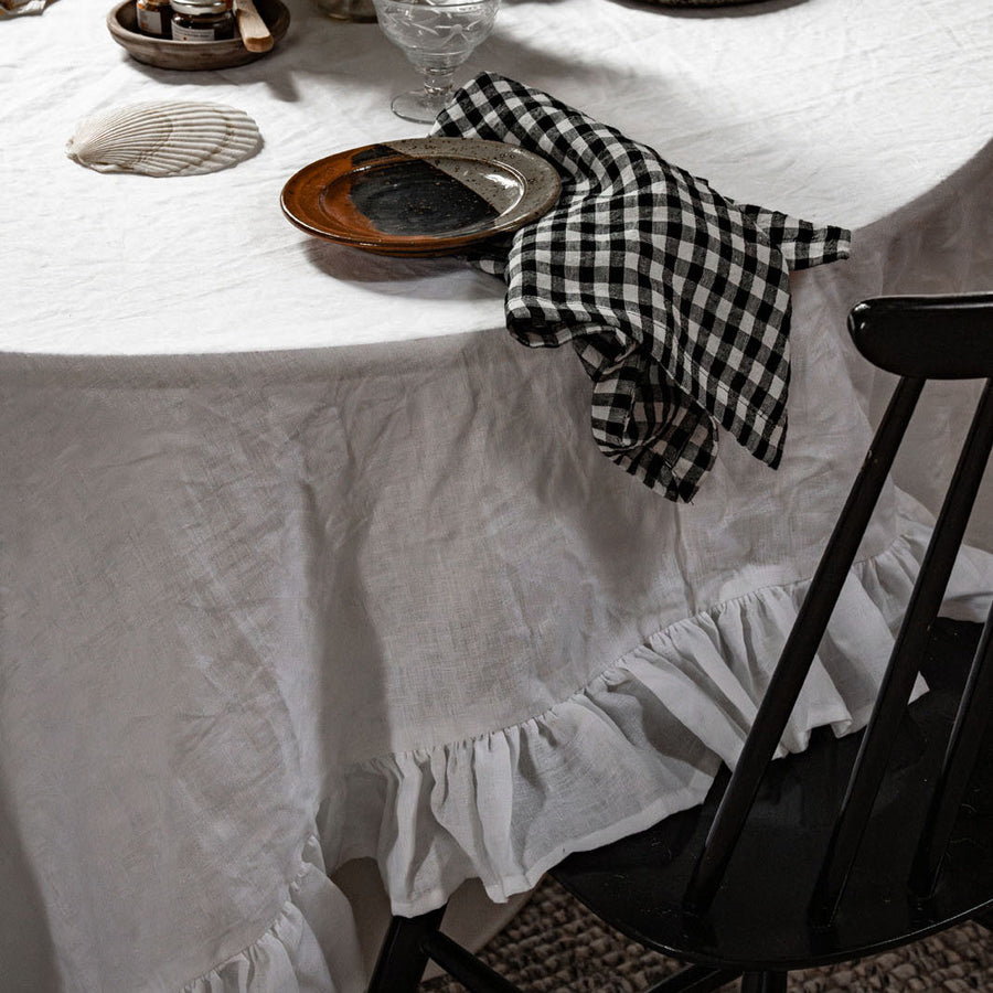 White Linen Table Cloth with Ruffles styled for a quiet dinner