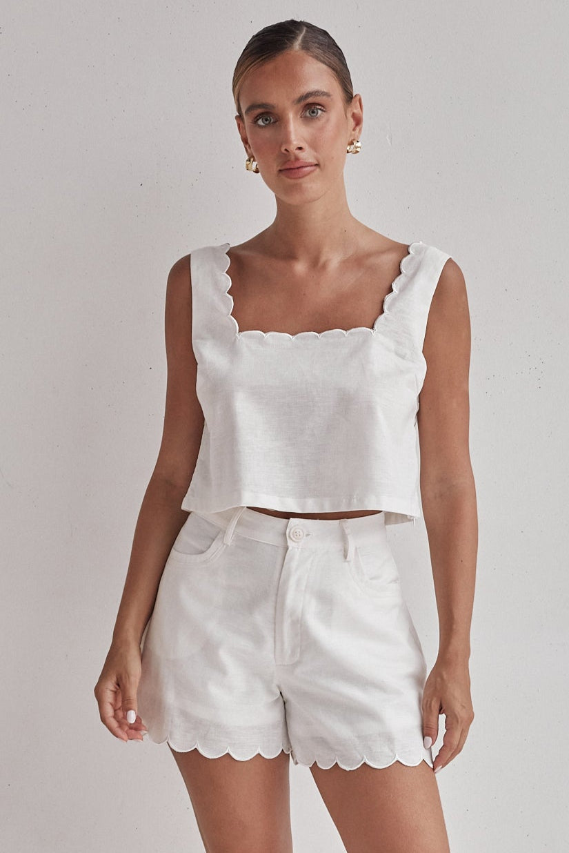White linen crop top with scalloped hem, sleeveless summer style