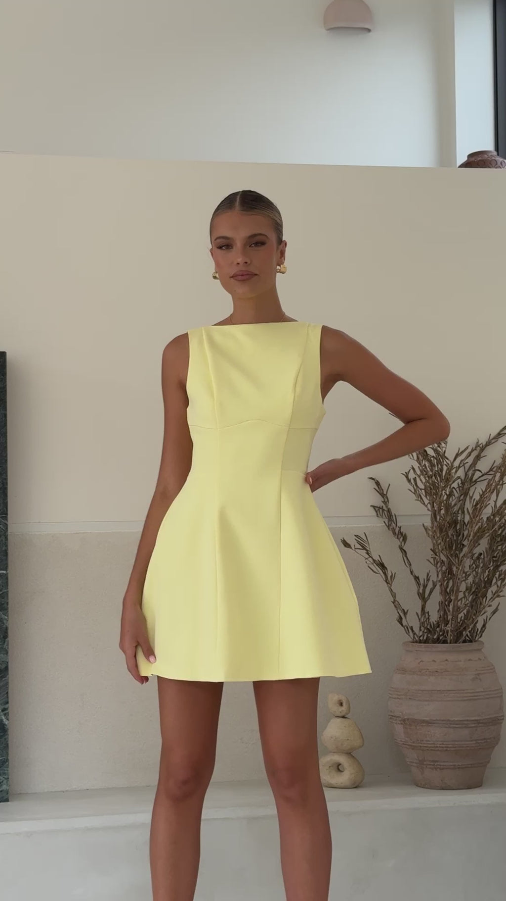 Butter yellow banana crepe sleeveless mini dress with A-line silhouette