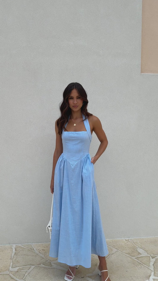 Powder blue linen midi dress with halter neckline, flared skirt, and smocked back