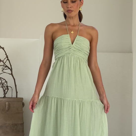 Sage green moss cotton maxi dress with halter neckline and tiered skirt