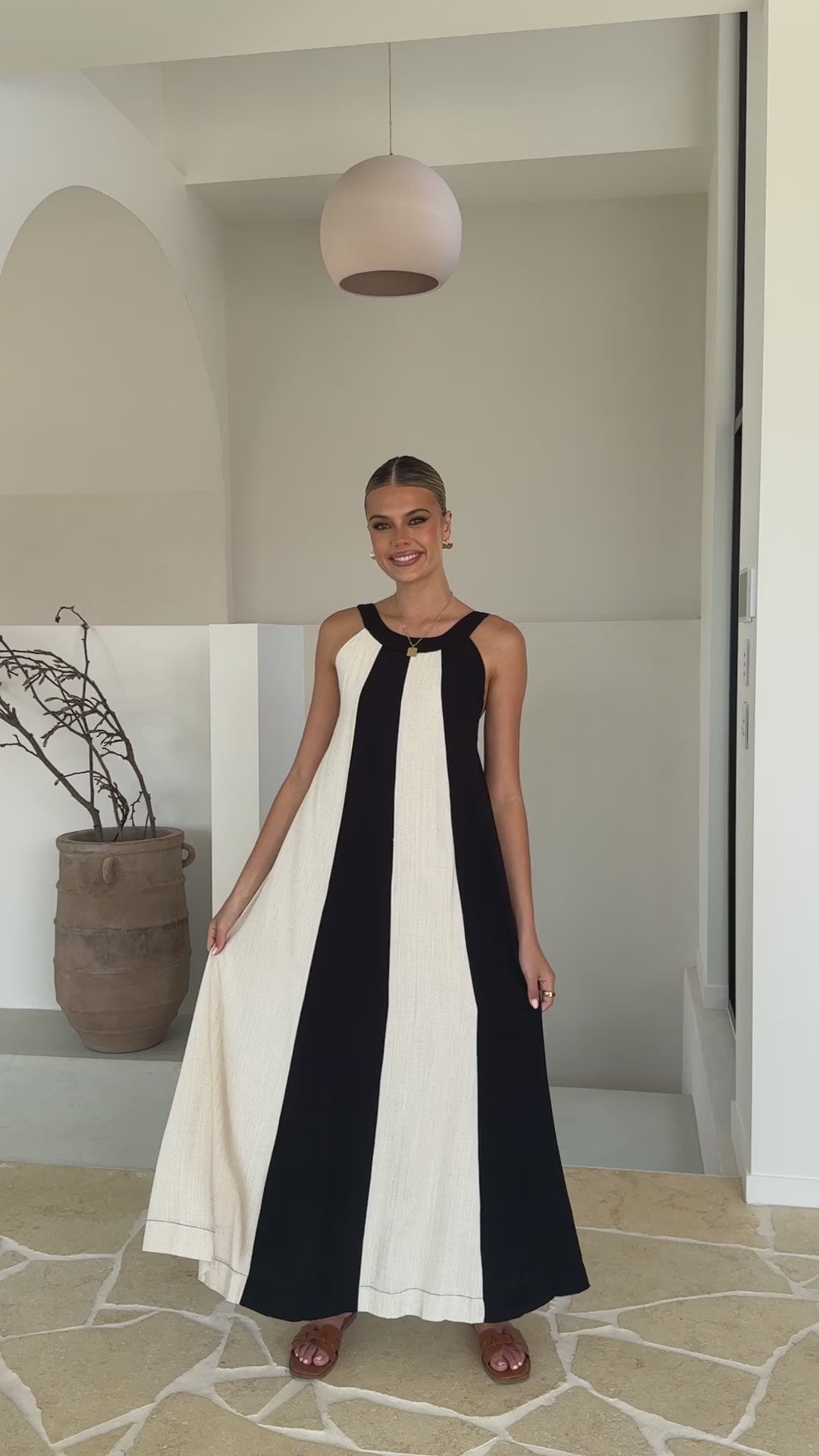 Black and white colorblock linen dress with gathered neckline and wide straps