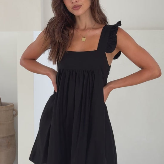 Black cotton mini dress with ruffle straps and square neckline