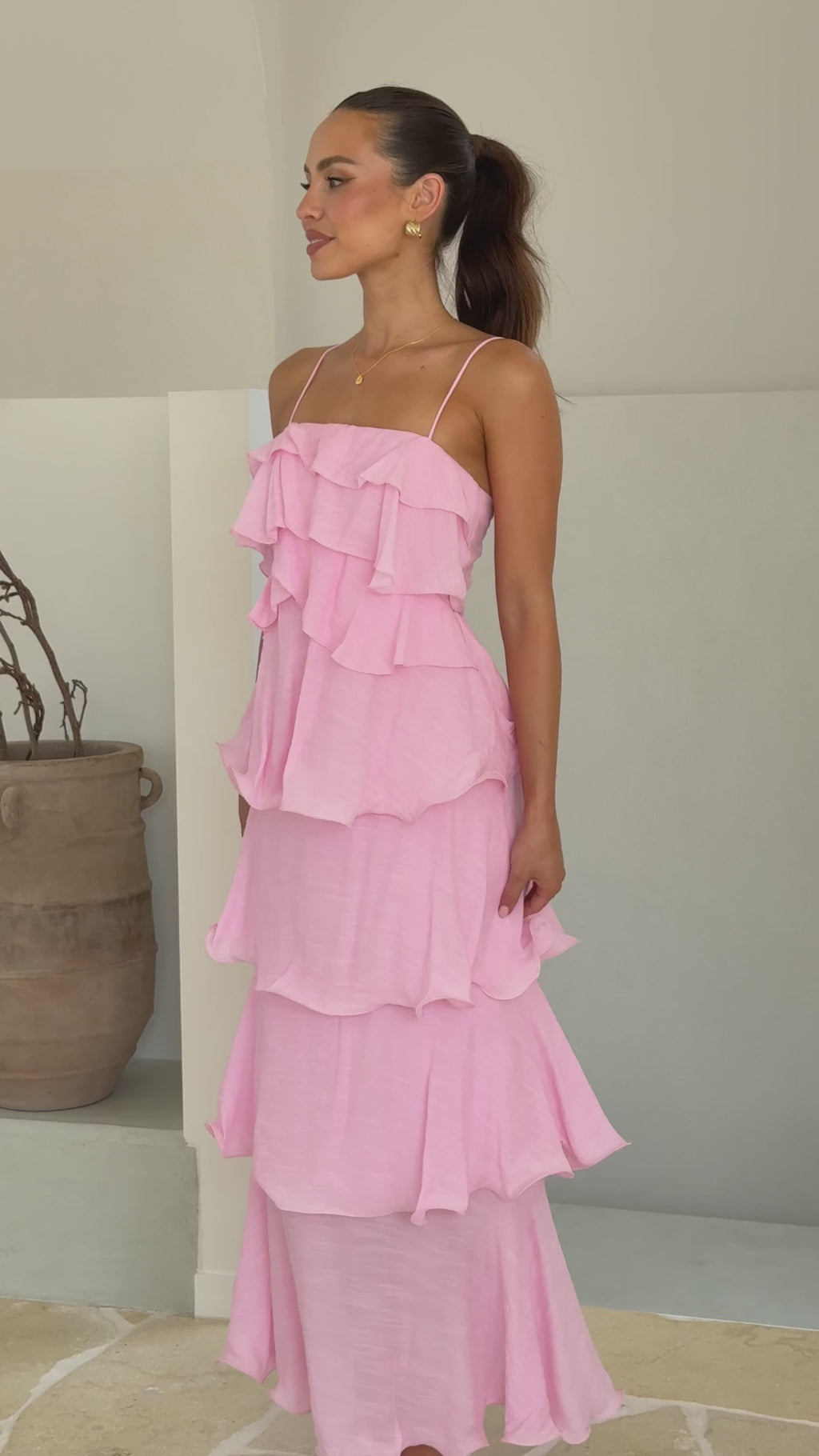 Pink crepe maxi dress with layered ruffles and spaghetti straps