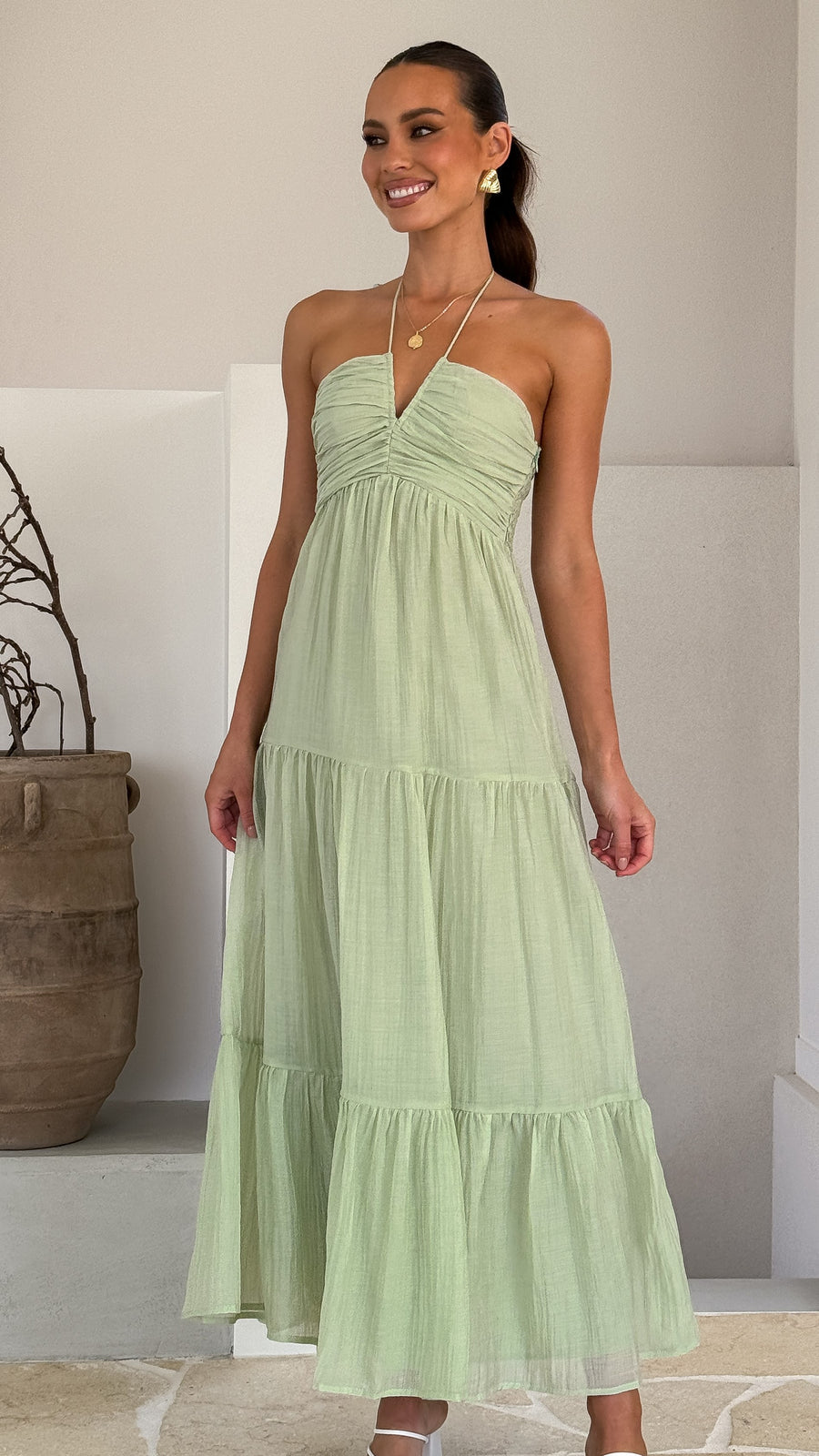 Sage green moss cotton maxi dress with halter neckline and tiered skirt