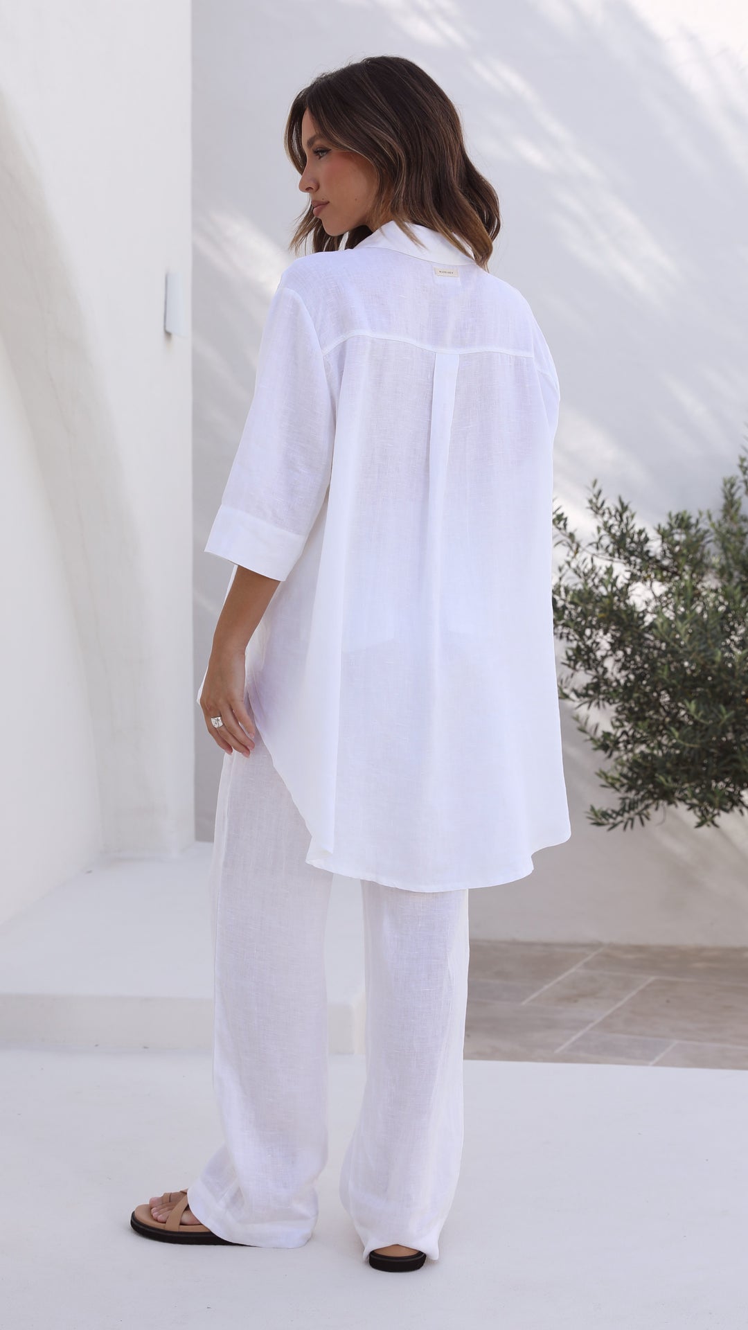 White linen shirt with longline back, 3/4 sleeves, and button front