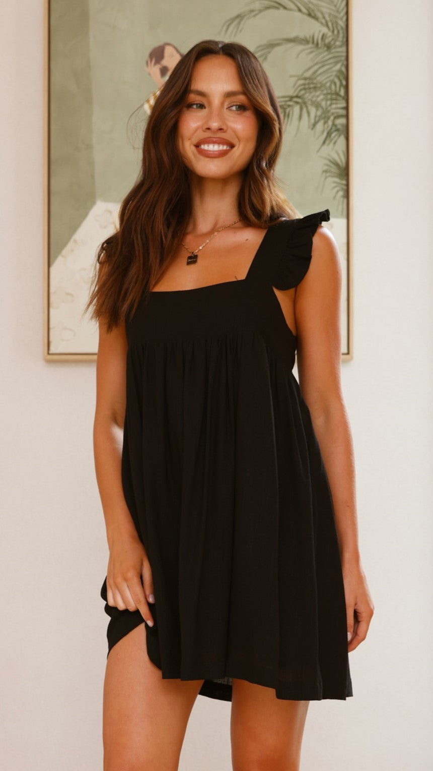 Black cotton mini dress with ruffle straps and square neckline
