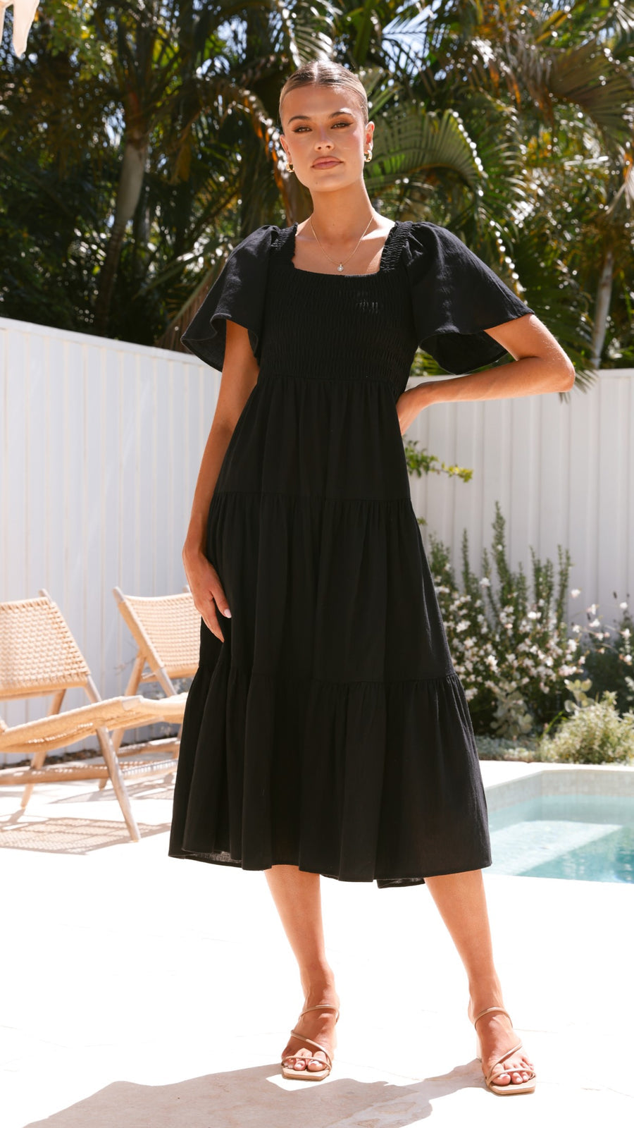 Black linen maxi dress with smocked bodice and flutter sleeves