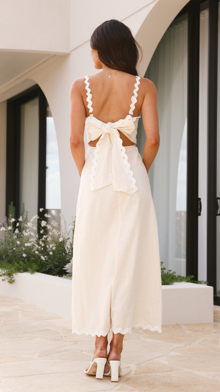 Ivory linen midi dress with scalloped straps and oversized back bow