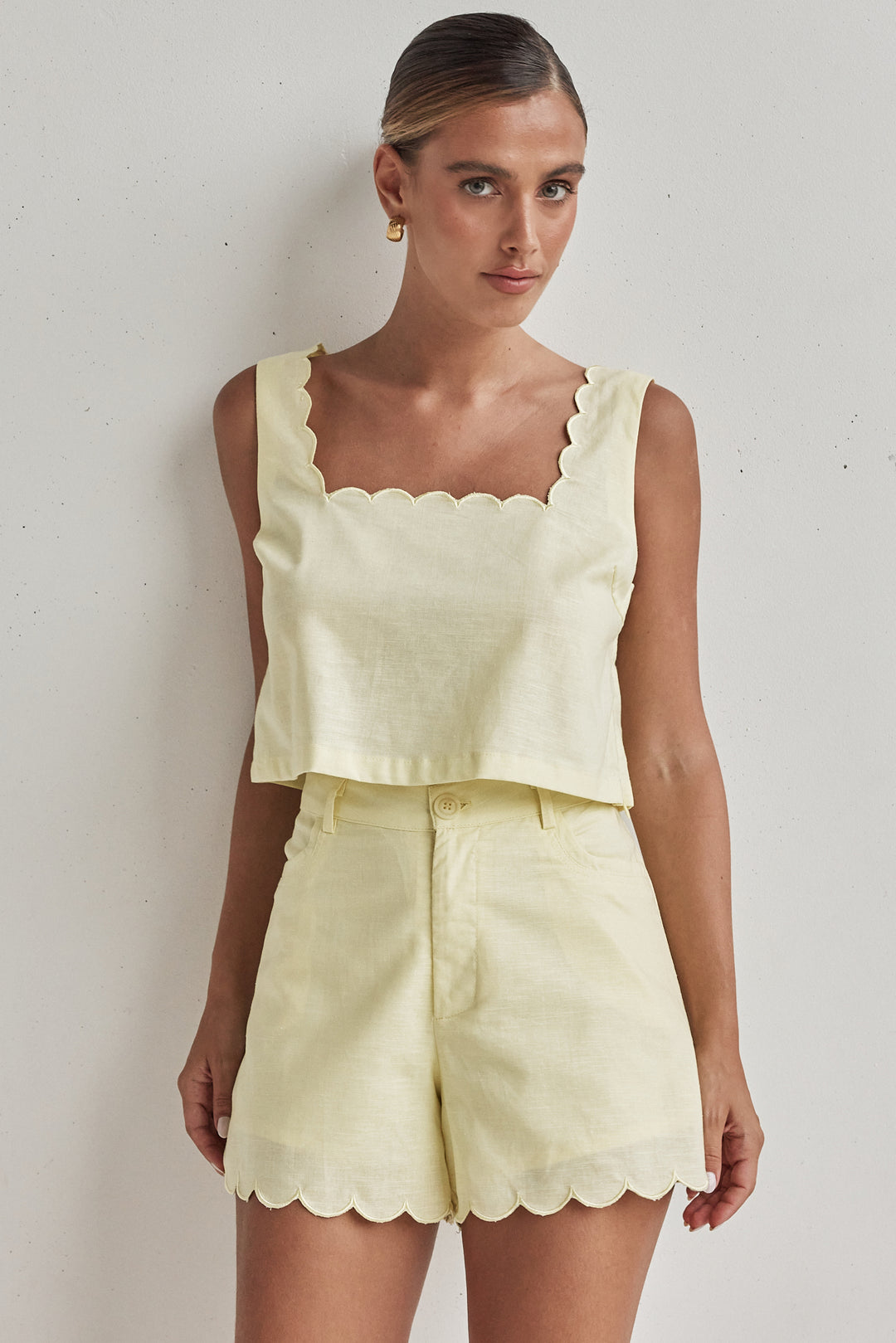 Butter yellow linen shorts for women with scalloped hem and high waist