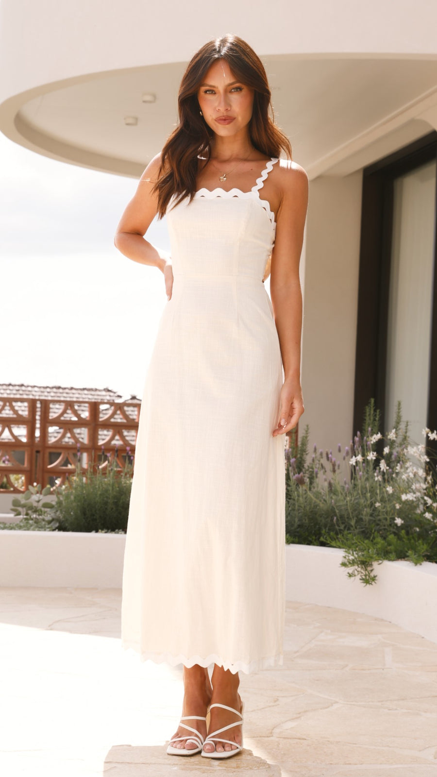 Ivory linen midi dress with scalloped straps and oversized back bow