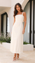 Ivory linen midi dress with scalloped straps and oversized back bow