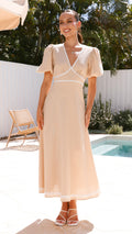 Beige linen maxi dress with puff sleeves, lace trim, and V-neckline