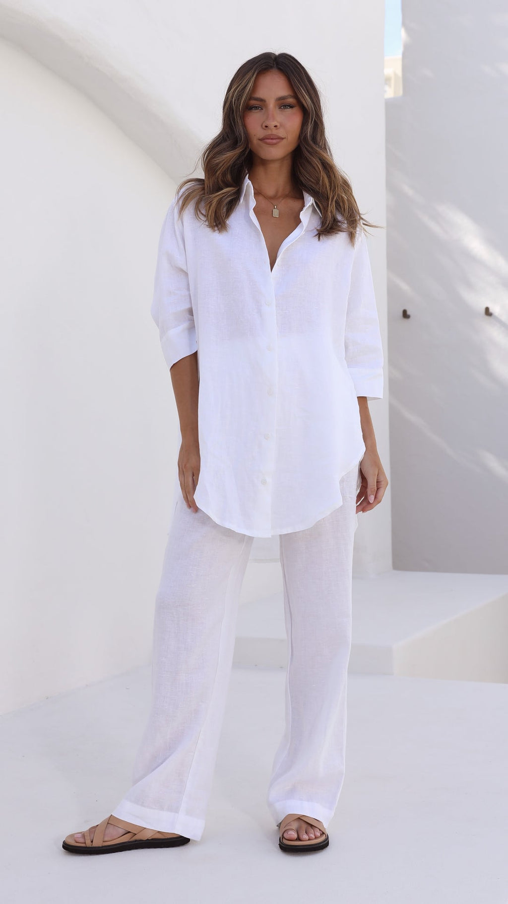 White linen shirt with longline back, 3/4 sleeves, and button front