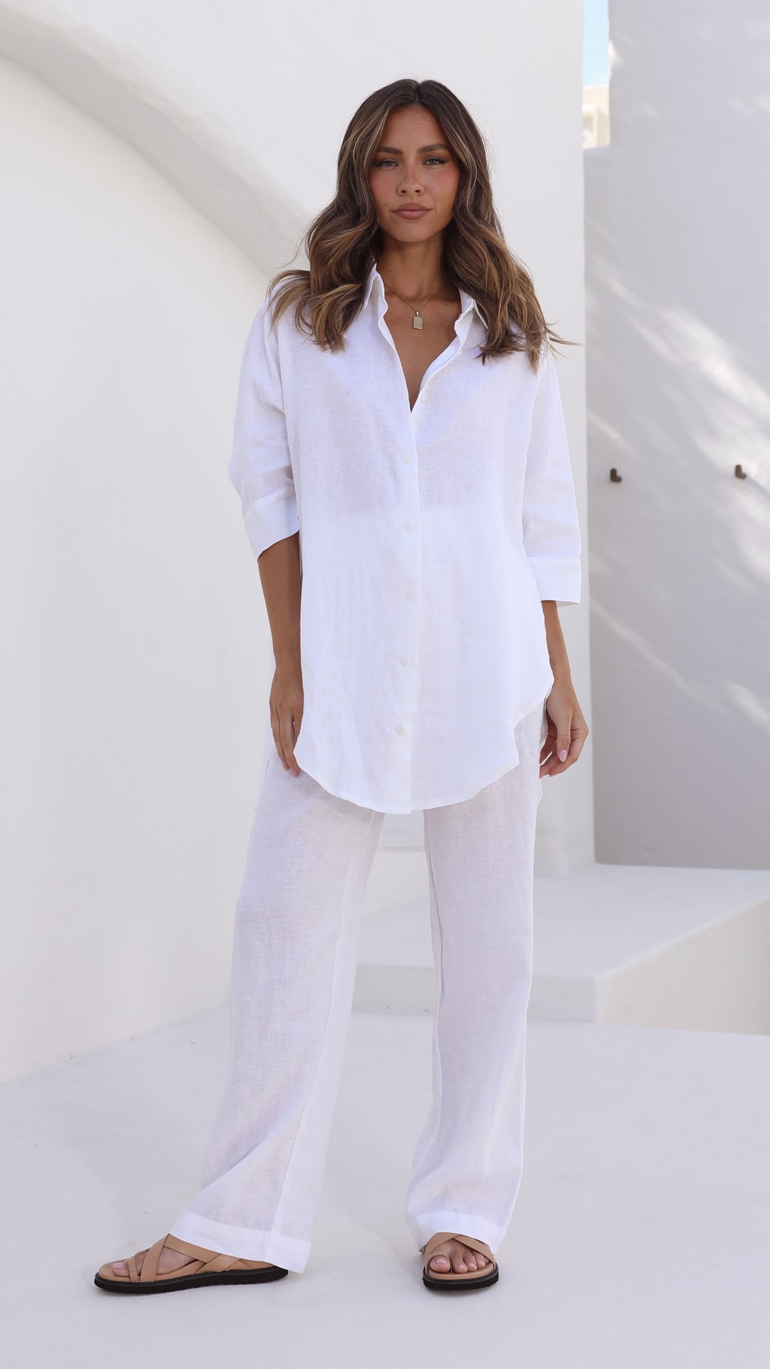 White linen shirt with longline back, 3/4 sleeves, and button front